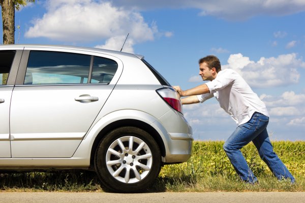 extended car warranty services protect my car car broken man pushing broken car on the side of the road